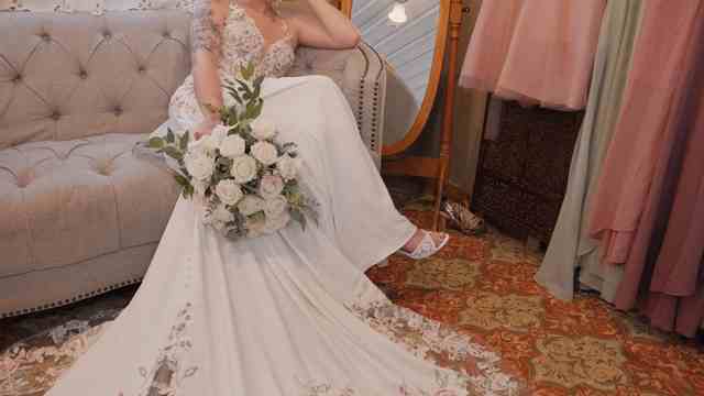 Bride holding her bouquet before the ceremony